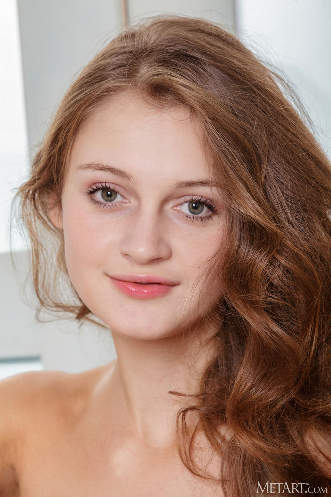 Linessa With Wavy Brunette Hair Framing Her Big Blue Eyes And Pretty Smile - Met Art