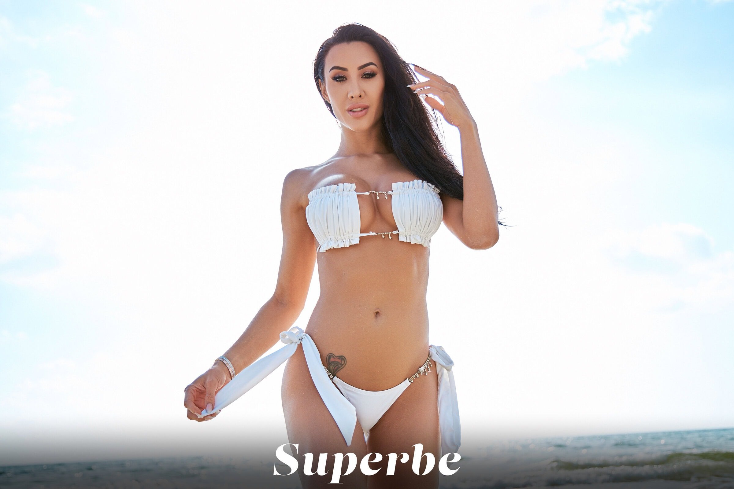 Corrie Yee showcases her slim body while getting rid of her white bikini