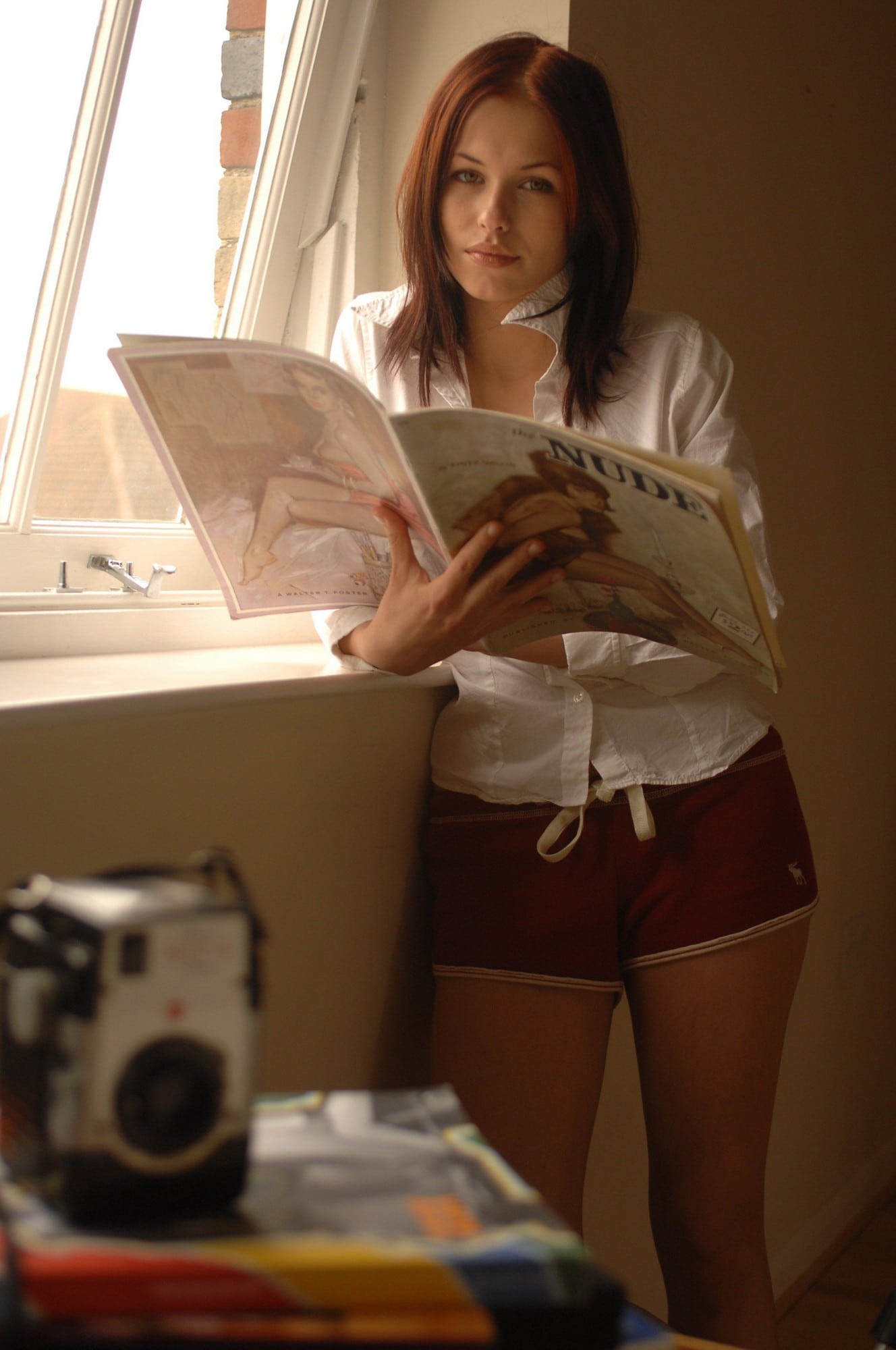 Iga Wywral in white shirt getting naked