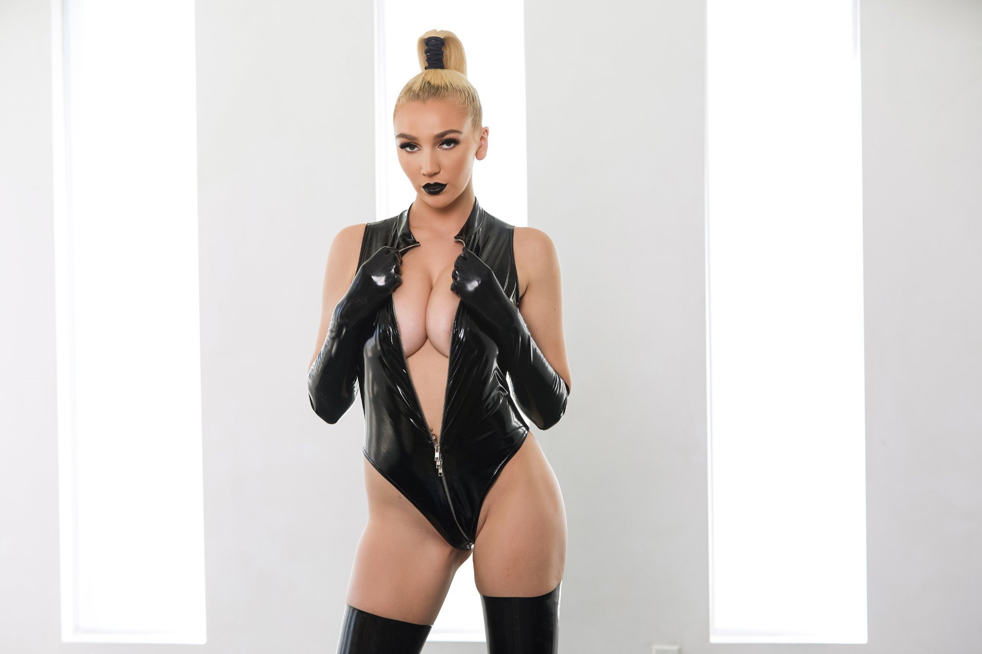 Kendra Sunderland ripping off her black latex bodysuit