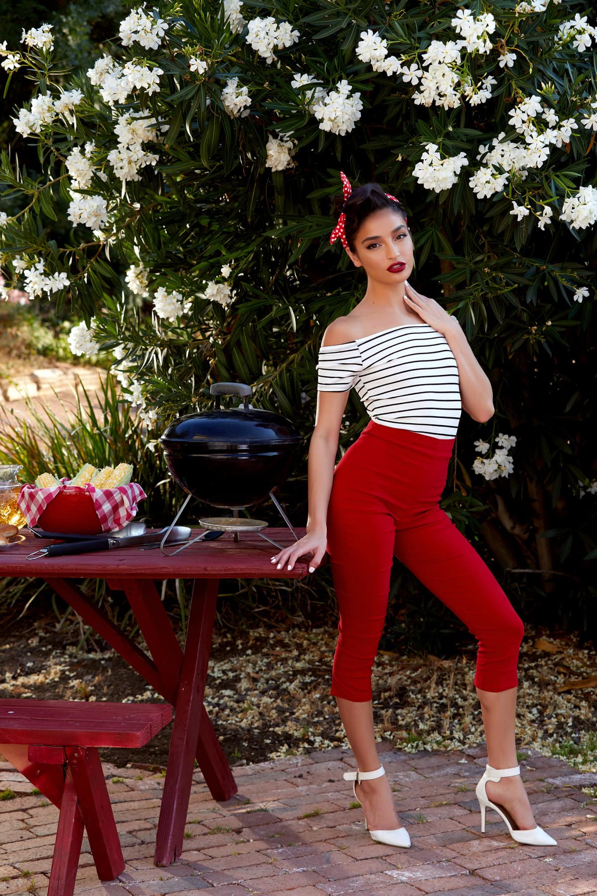 Emily Willis takes off her skin tight red pants in the outdoors