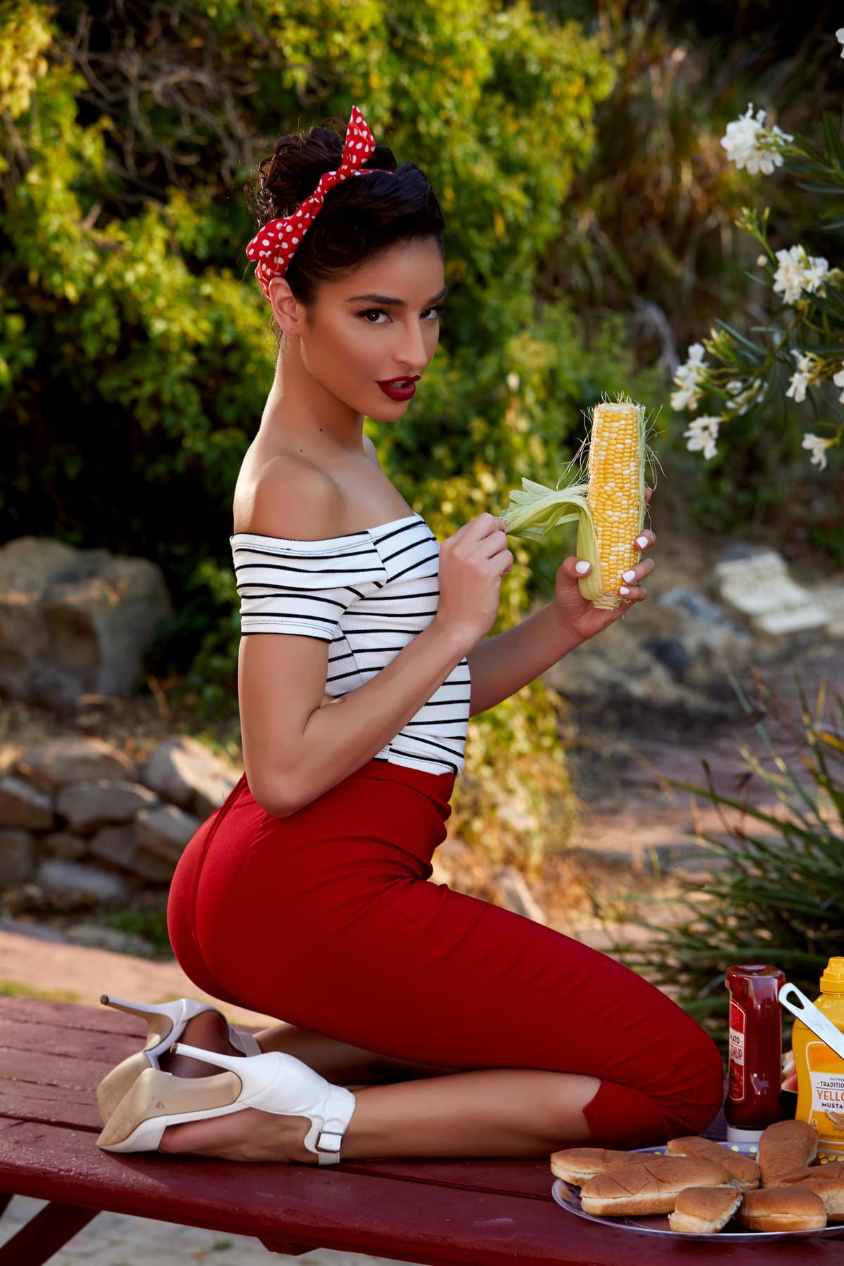 Emily Willis takes off her skin tight red pants in the outdoors