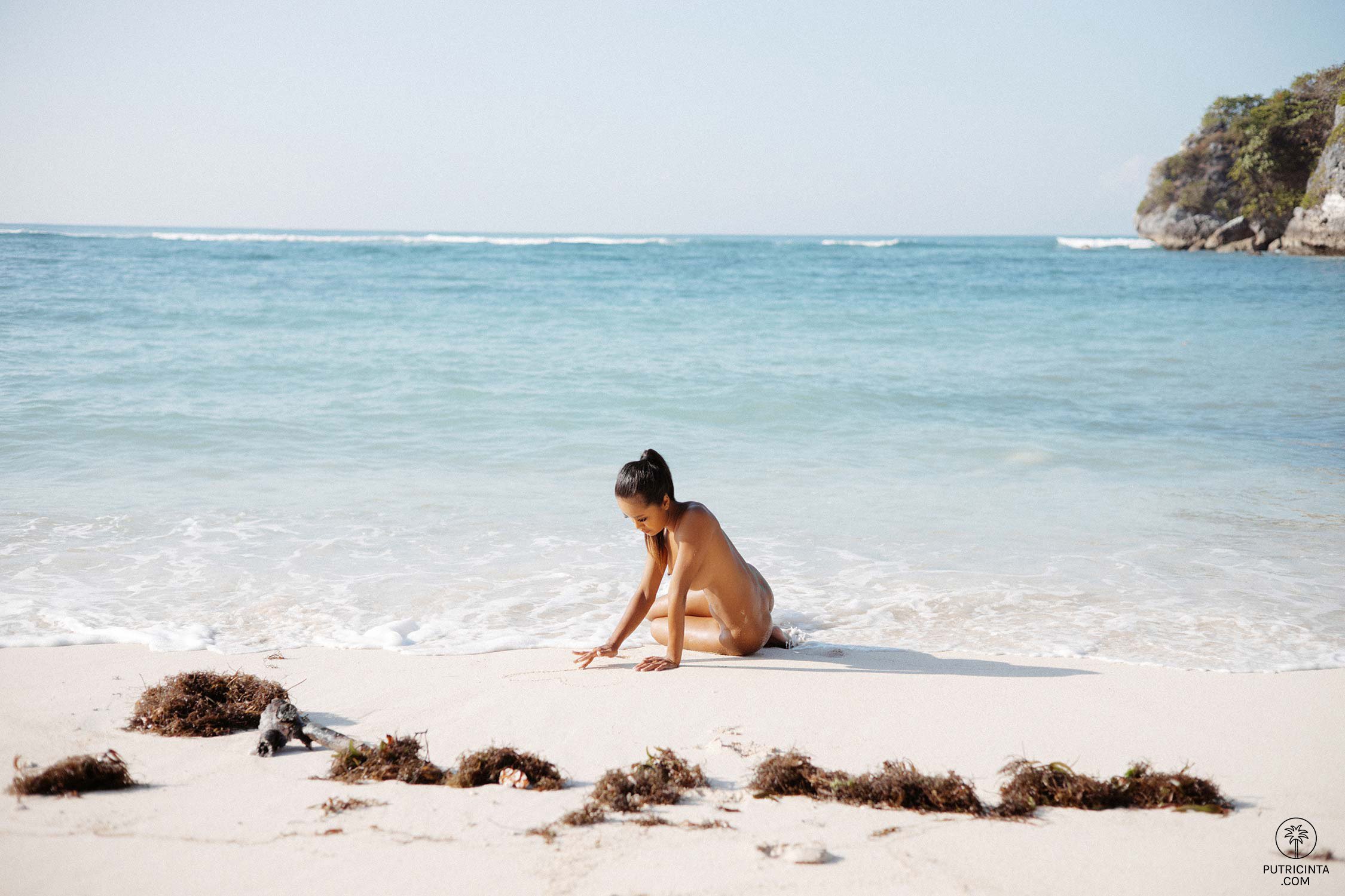 Hot Putri Cinta drops black lingerie at the beach showing her bubble butt and big boobs