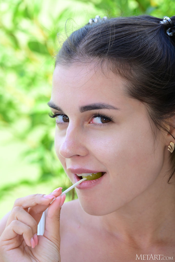 Alina Sucking On A Lollipop As She Swishes Her Long Pigtails In The Breeze