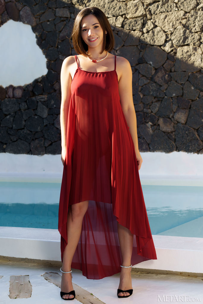 Eve Sweet Smiling Seductively As She Lifts The Hem Of Her Long Red Dress To Reveal Her Lacy Panties