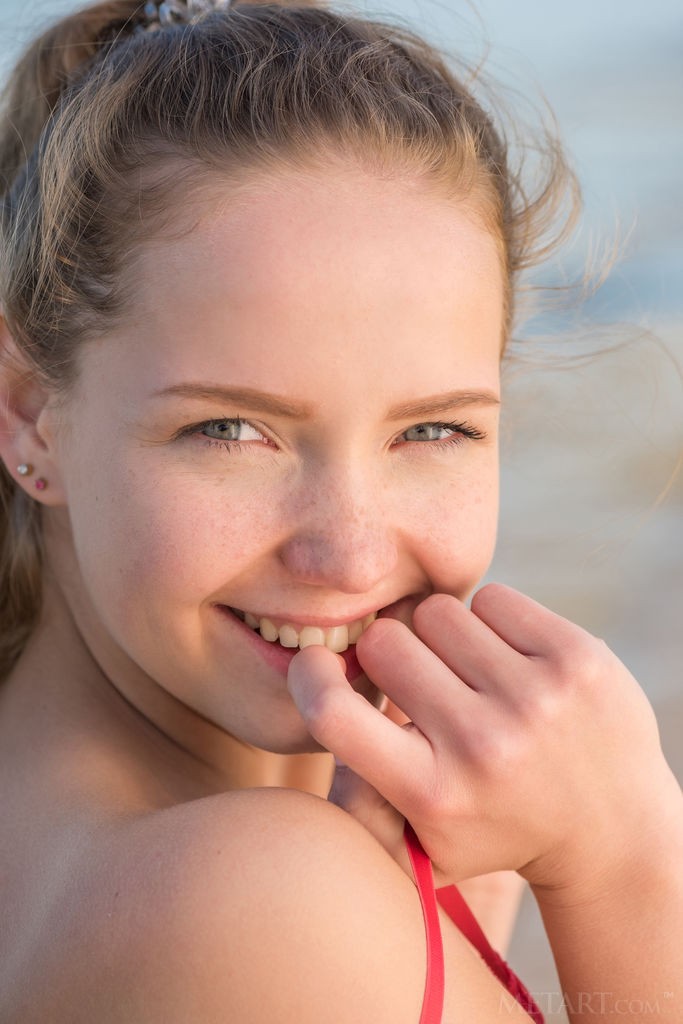 Faina Bona - Shaved teen cutie on the beach exposing her irresistible bod