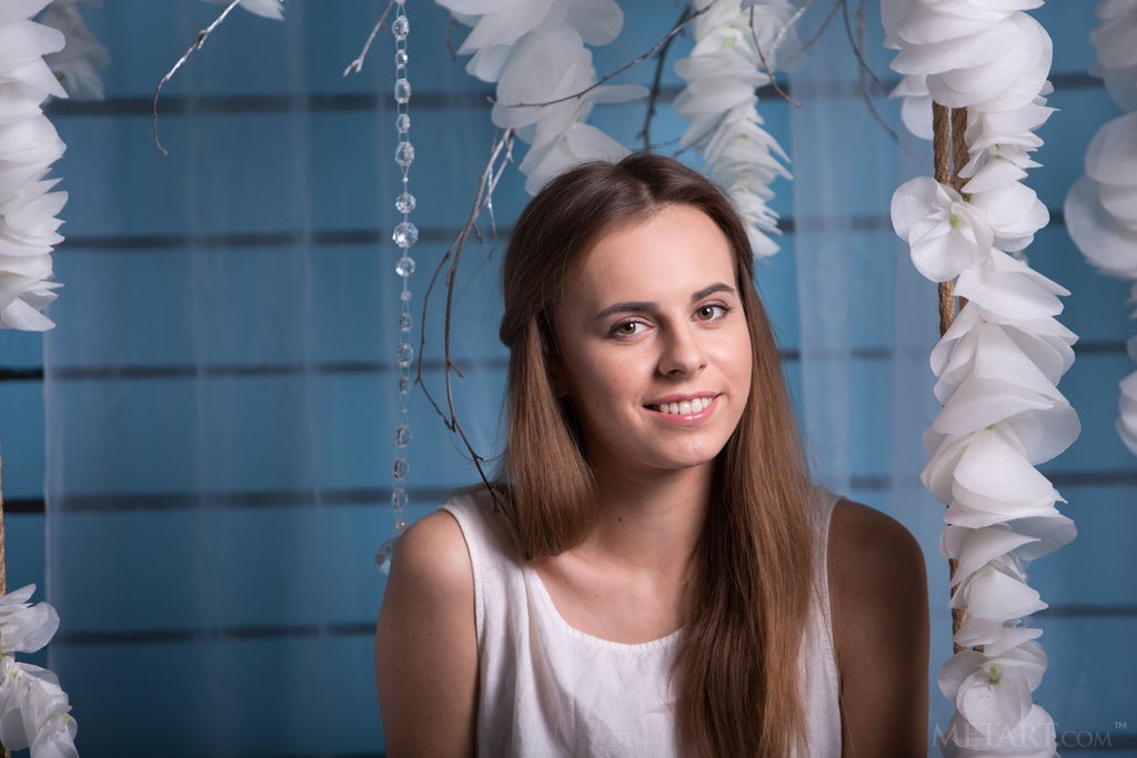 Gracie - Barely legal teen posing on a swing in a white dress