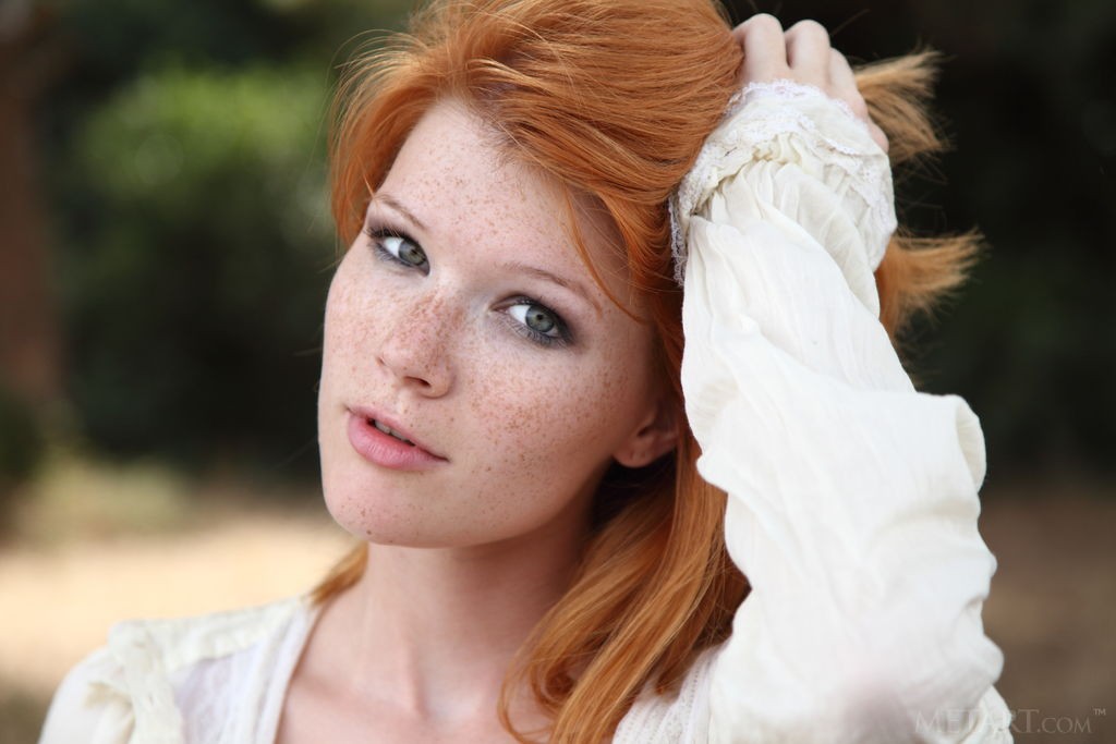Mia Sollis - Red-haired hottie goes for a walk with umbrella