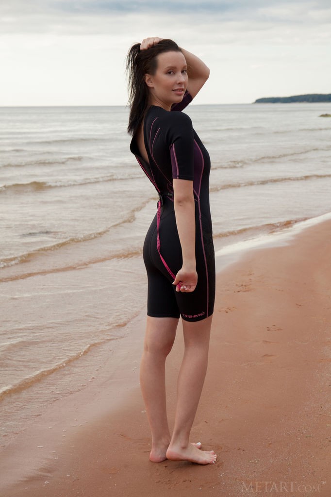 Agatha - Busty babe lies down on wet sand to masturbate