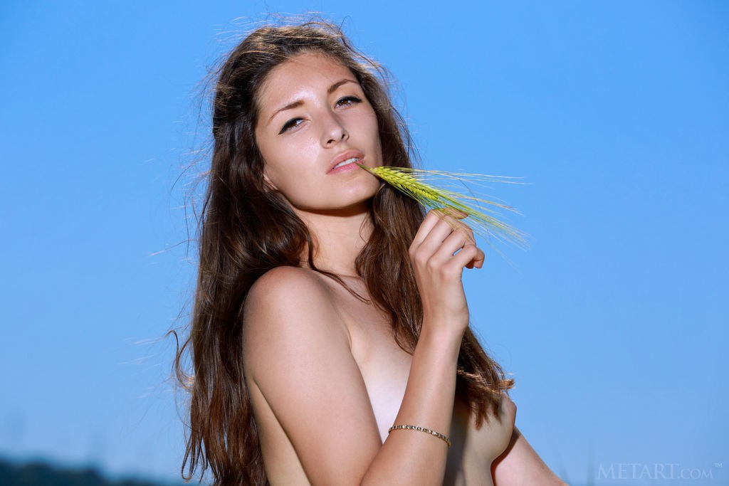 Rosella - Naked outdoors, she loves the feel of soft grass on her ass