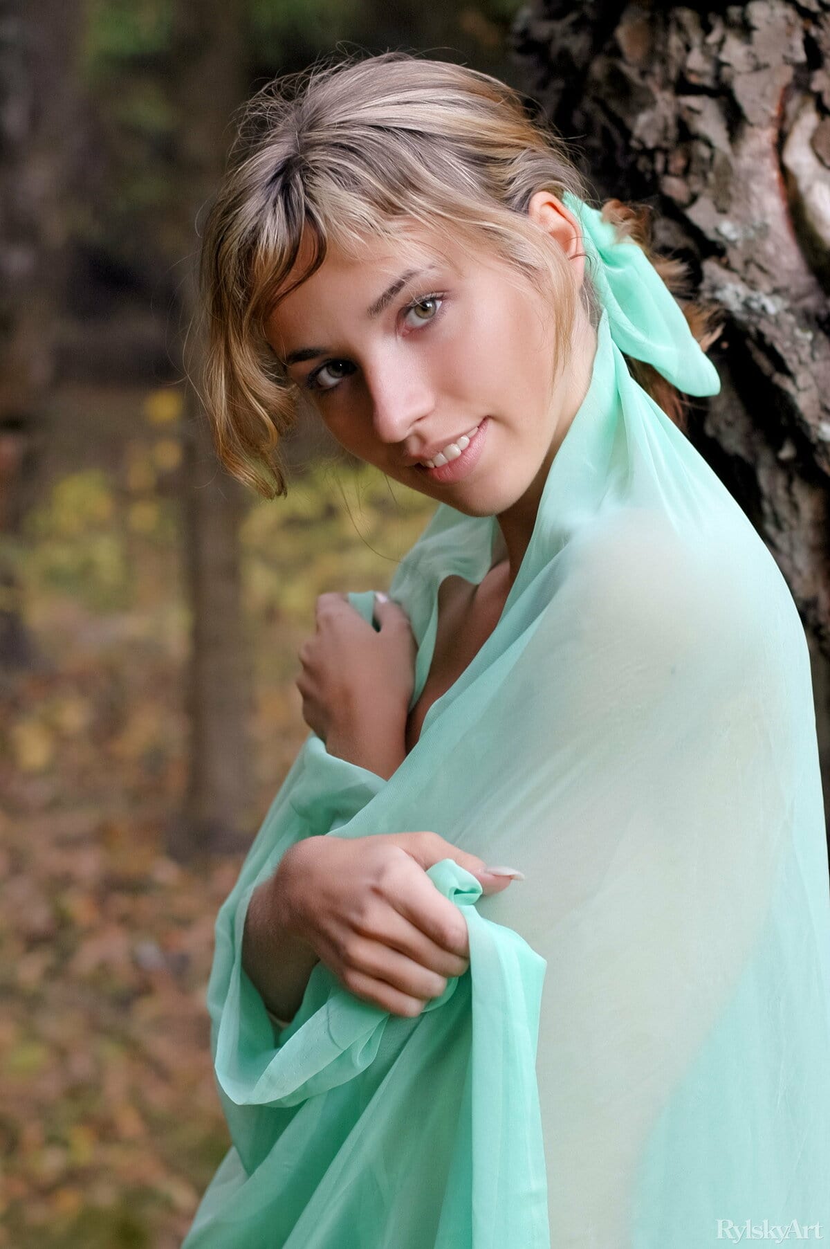 Natalia B shows her small breasts and trimmed pussy in the forest