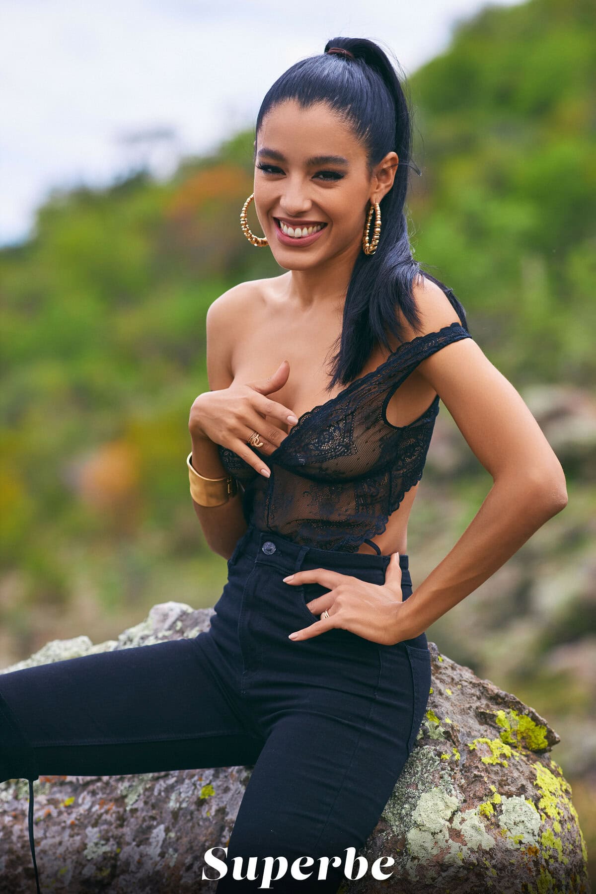 Natalia Bruni displays her mouthwatering figure and big boobs on the jungle rock