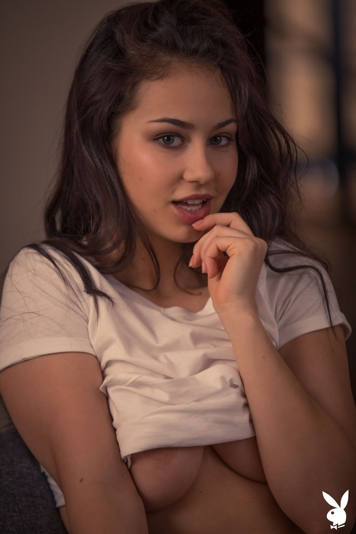 Tempting babe Sophie Limma takes off her white panties on the sofa