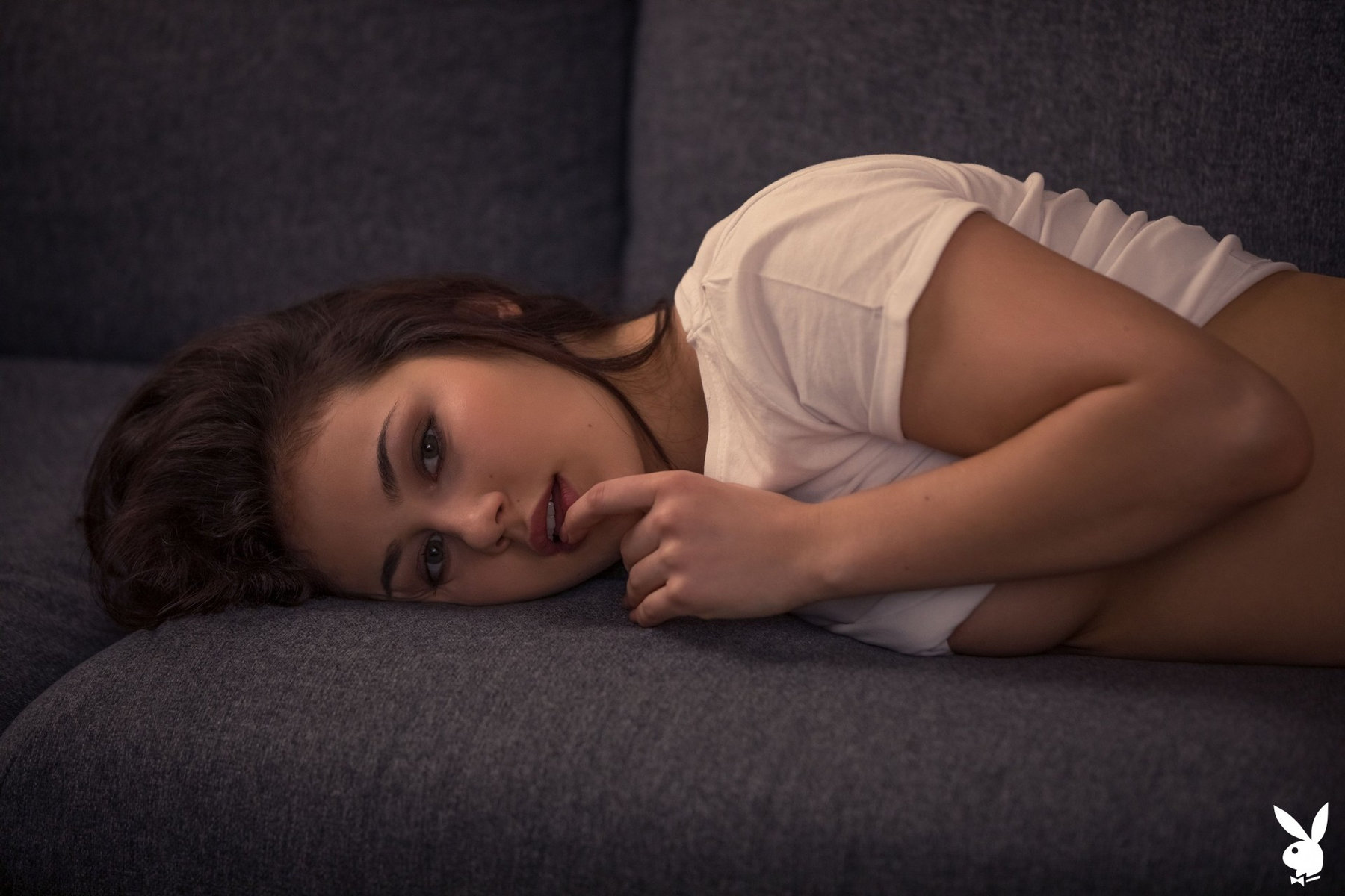 Tempting babe Sophie Limma takes off her white panties on the sofa