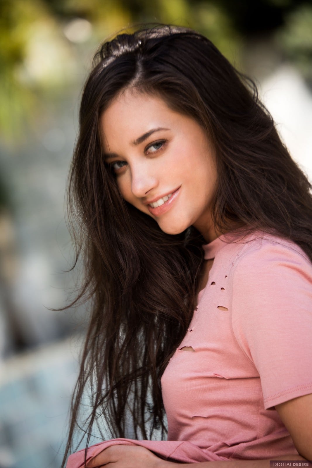 Gia Paige is a young brunette pretty by the poolside